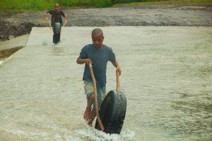 Kids playing in post Cyclone Ita floodwaters - Alotau, Milne Provence, PNG